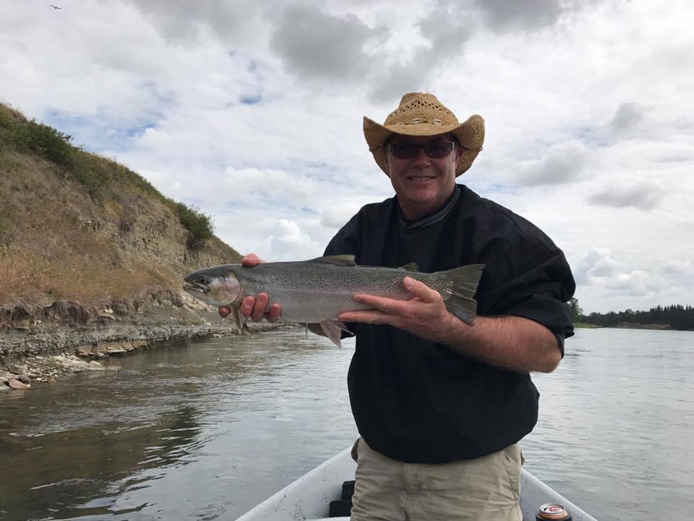 fishing guide alberta with trout drift boat