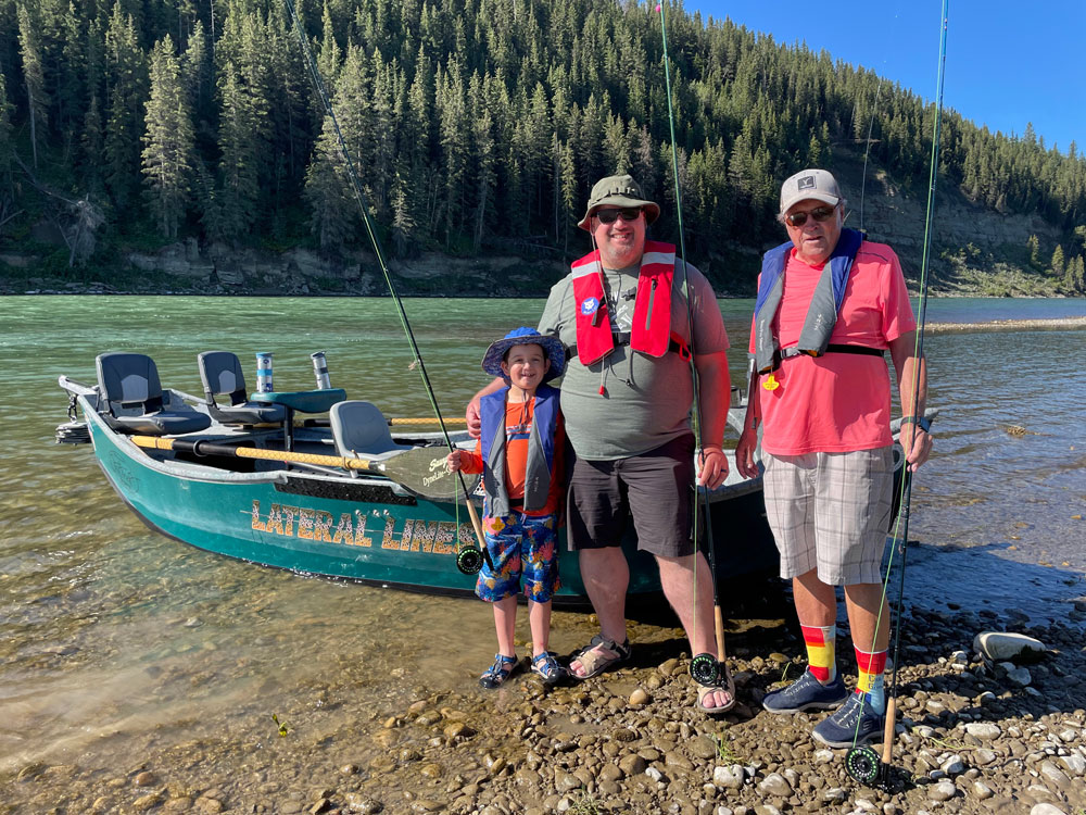 family of tourists come from usa, europe, australia on bow river
