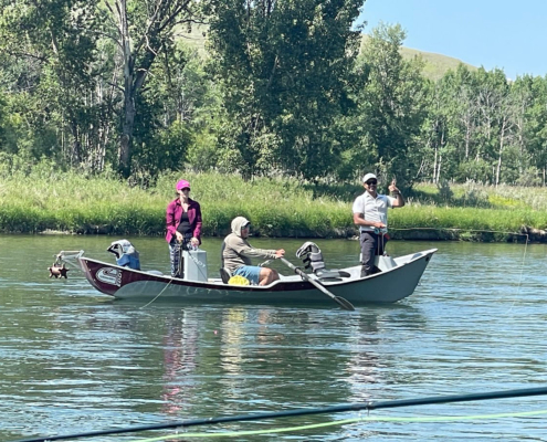 drift boat fly fishing group bow river