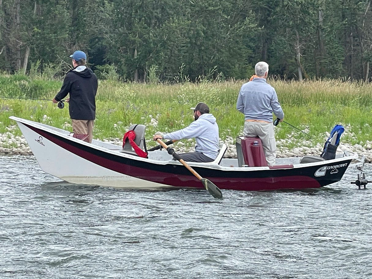 drift boat fly fishing group bow river