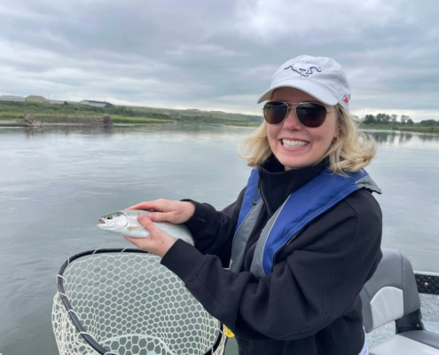 small trout caught from drift boat