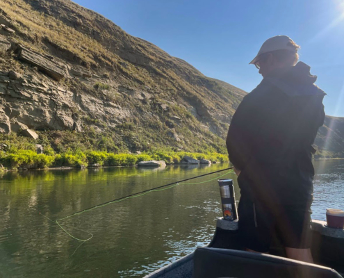 trout fishing on bow river using a drift boat and casting for trout