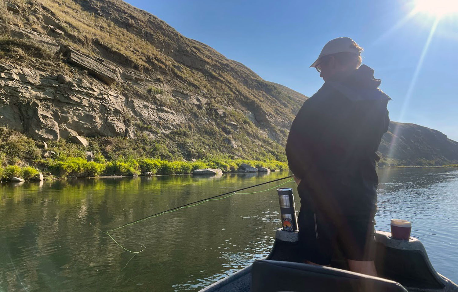 trout fishing on bow river using a drift boat and casting for trout